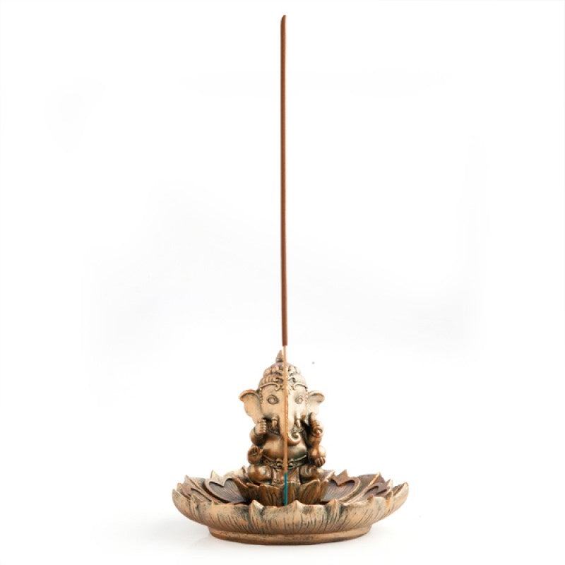 Gold Ganesh figure sitting on lotus-shaped incense burner with antique gold finish