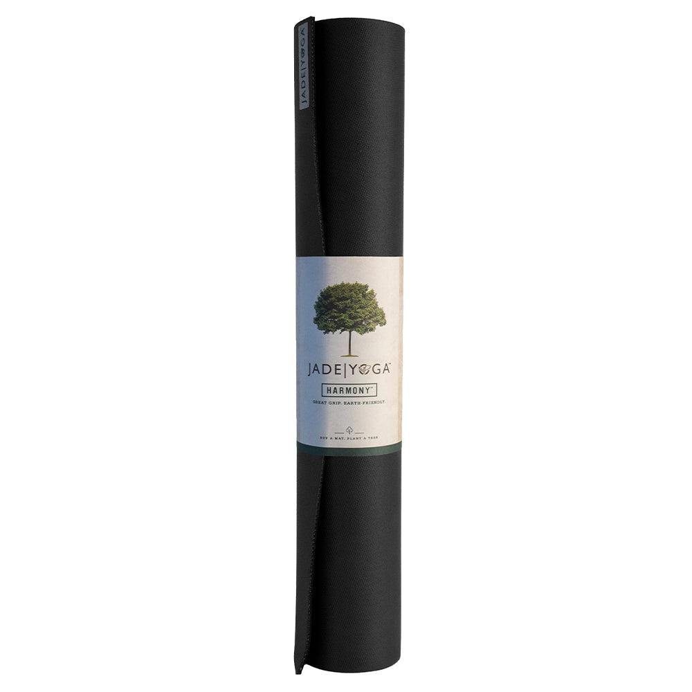 Rolled black Jade Yoga Harmony Mat made from natural rubber with firm grip and cushion