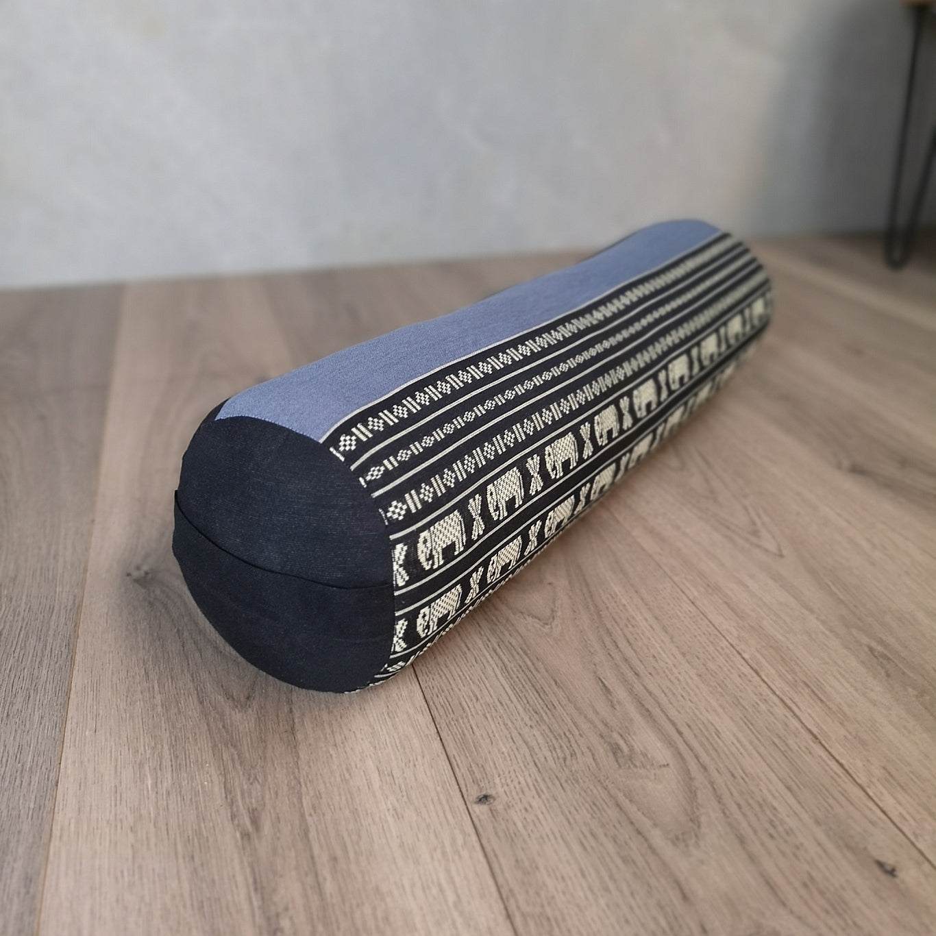 Blue yoga bolster block filled with organic kapok fiber featuring handmade cotton fabric and patterned elephant design