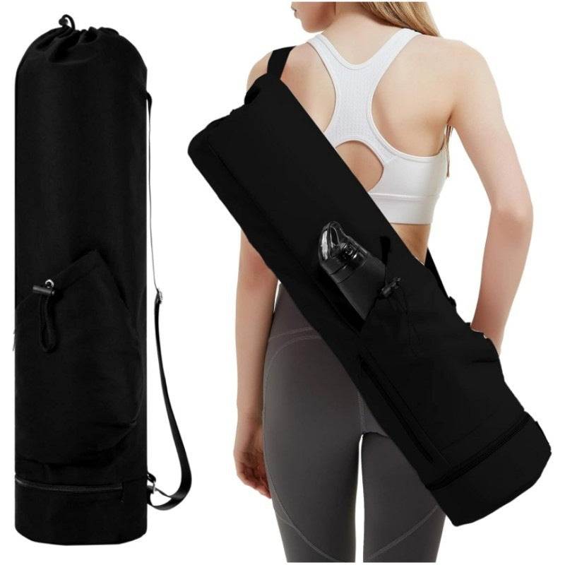 Black durable yoga mat carry bag with adjustable shoulder strap and wet pocket, shown carried by a woman in fitness wear