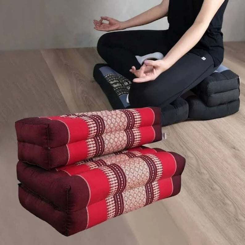 Red meditation cushion set with traditional Thai design, foldable and made of organic kapok cotton for supportive and comfortable yoga and meditation seating.