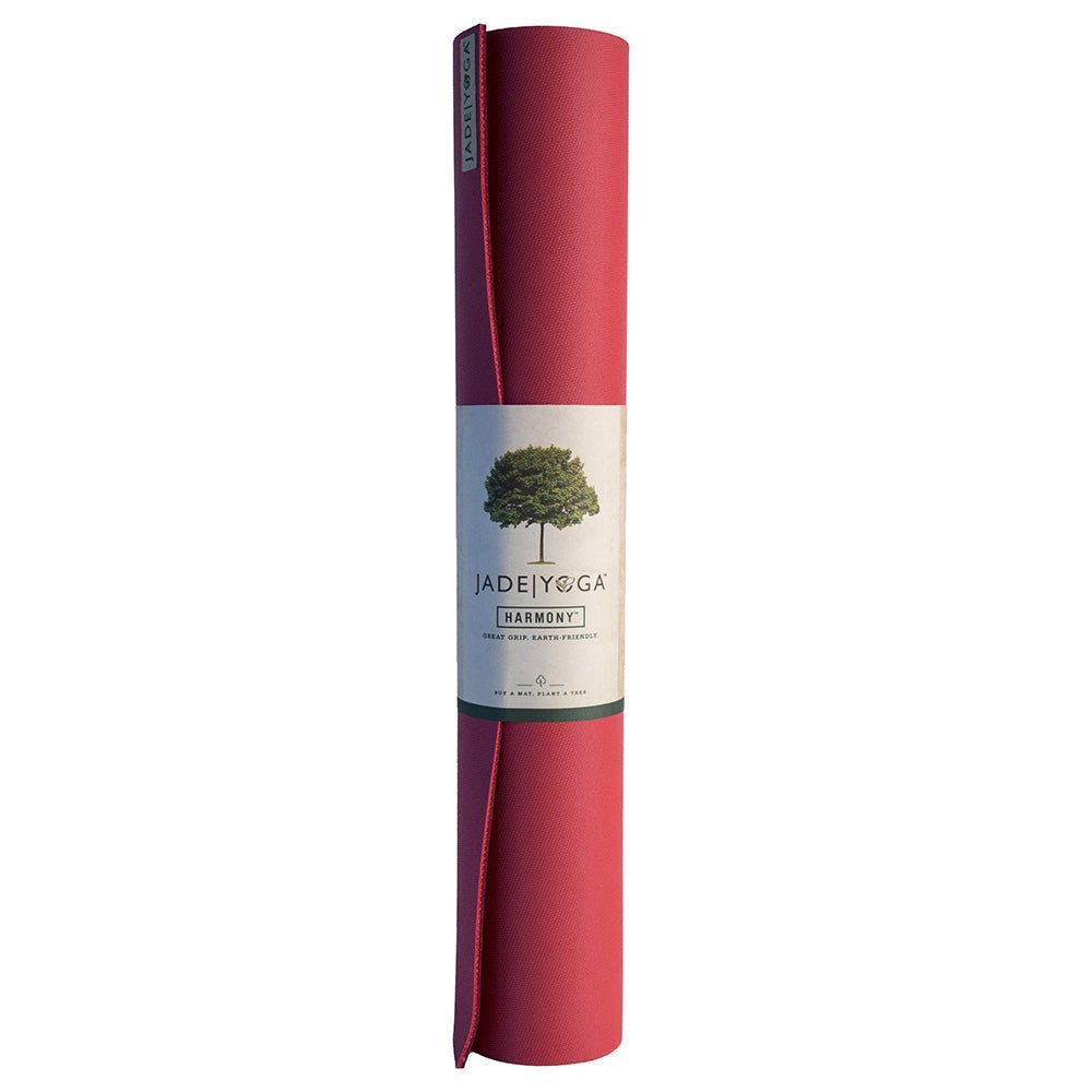 Rolled Raspberry Jade Yoga Harmony Mat made of natural rubber with firm grip and eco-friendly materials.