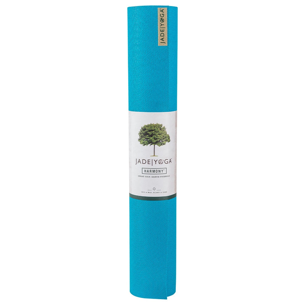 Rolled sky blue Jade Yoga Harmony Mat made from natural rubber with firm grip and eco-friendly design
