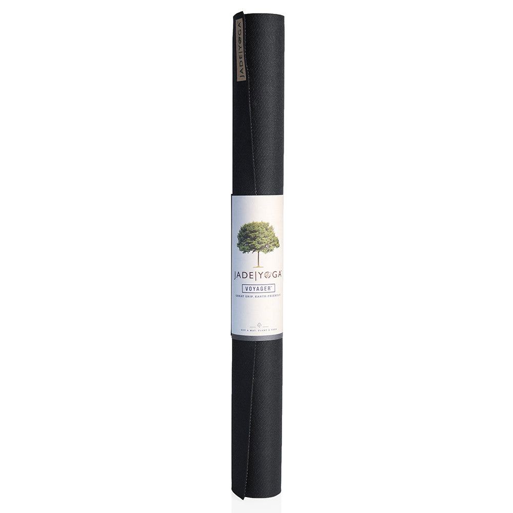 Rolled black Jade Yoga Voyager Mat made from natural rubber, lightweight and portable for travel.