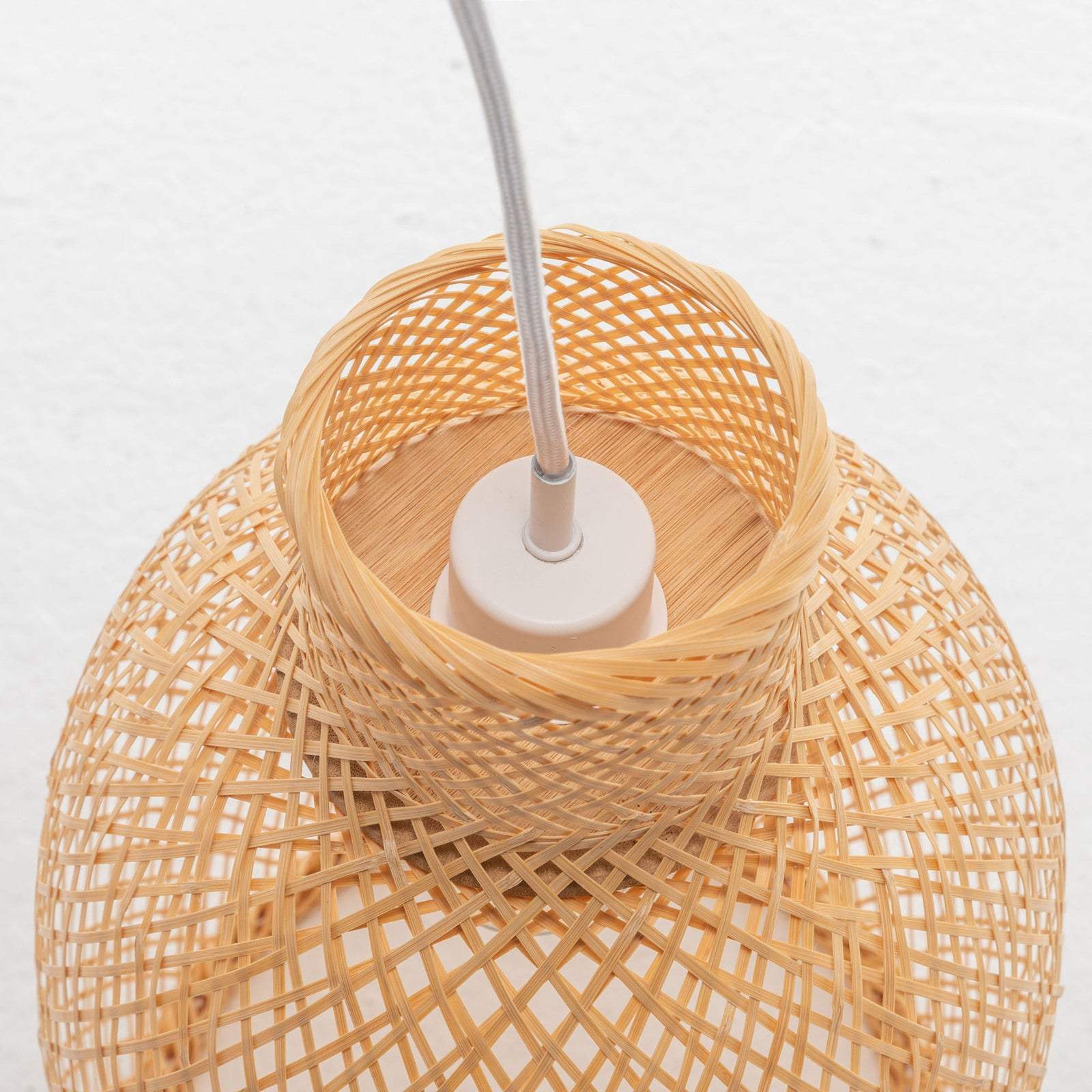 Natural woven bamboo cone pendant lamp with bell-shaped shade and adjustable cord for boho tropical decor