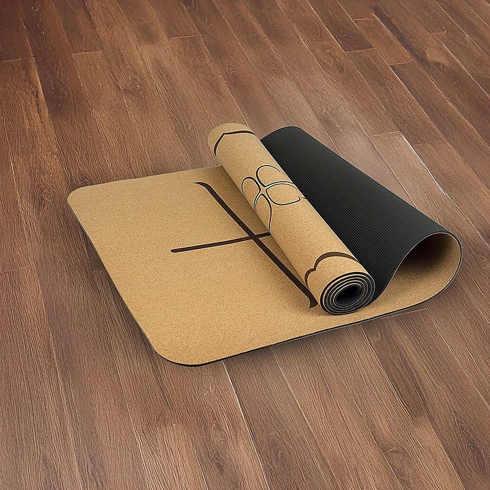 Eco-friendly Natural Cork TPE yoga mat with non-toxic ink markings on wooden floor