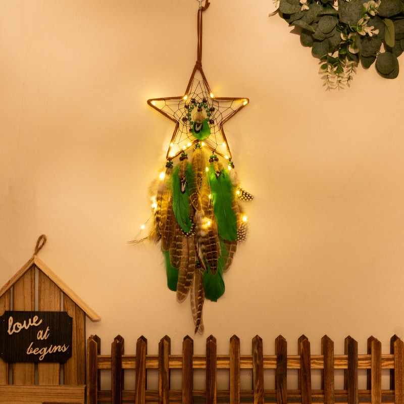 Boho star-shaped dreamcatcher with lights, feathers, and wind chimes for serene forest-style decor