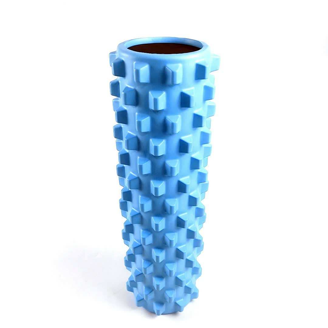 Blue solid yoga foam roller with textured wolf tooth pattern for muscle relaxation and deep massage, 45cm length