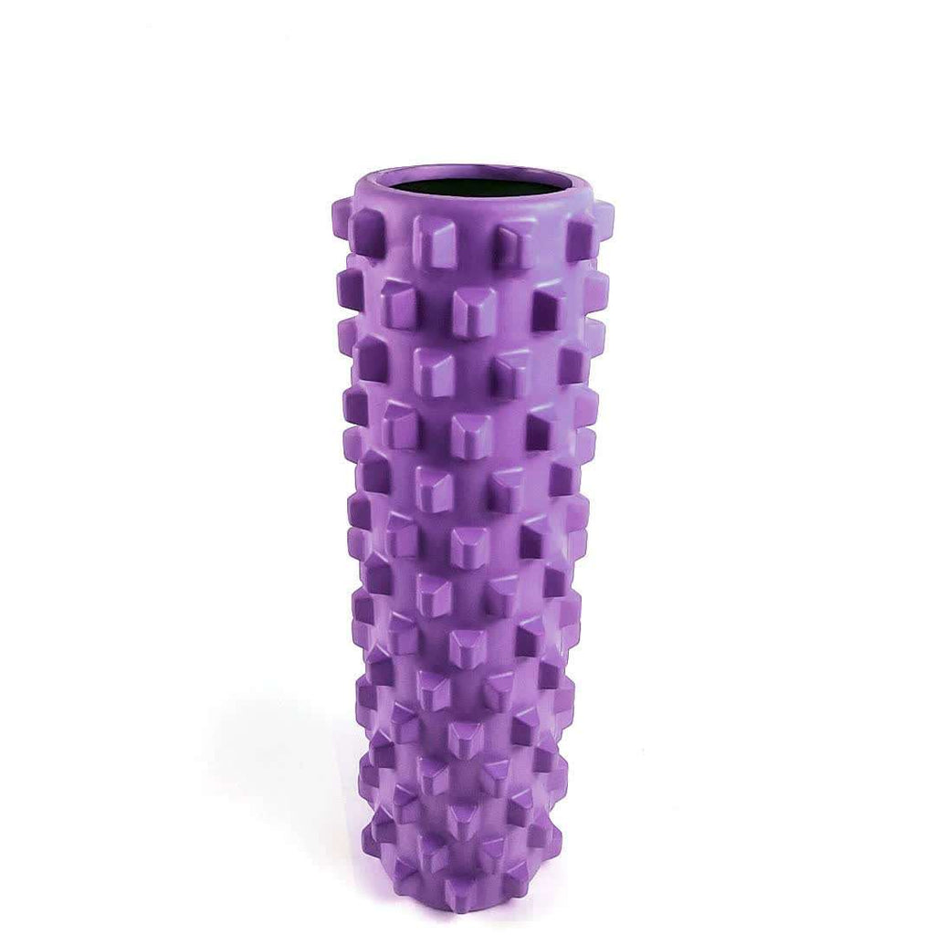 Purple solid yoga foam roller with textured wolf tooth design for muscle massage and relaxation.